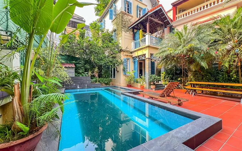 Swimming pool villa with 4 bedrooms and garden for rent on To Ngoc Van street, Tay Ho