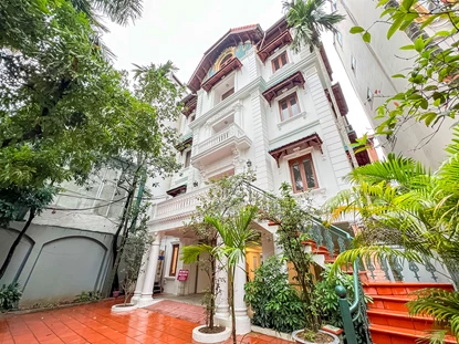 Unfurnished 4-bedroom house with huge yard for rent on To Ngoc Van Street, Tay Ho area