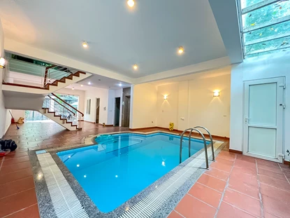 Semi-furnished 4-bedroom house with indoor swimming pool for rent on Dang Thai Mai Street, Tay Ho area