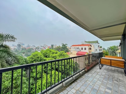 Greeny view spacious 4-bedroom apartment with large balcony for rent on Au Co Str, Tay Ho Area
