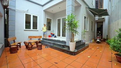 Semi furnished 4-bedroom house with big year for rent on To Ngoc Van Street, Tay Ho area