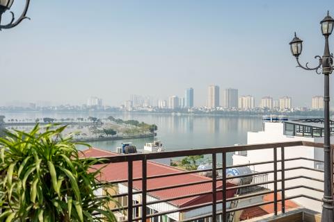 Lake view apartment with 2 bedrooms and a huge balcony for rent on To Ngoc Van street, Tay Ho